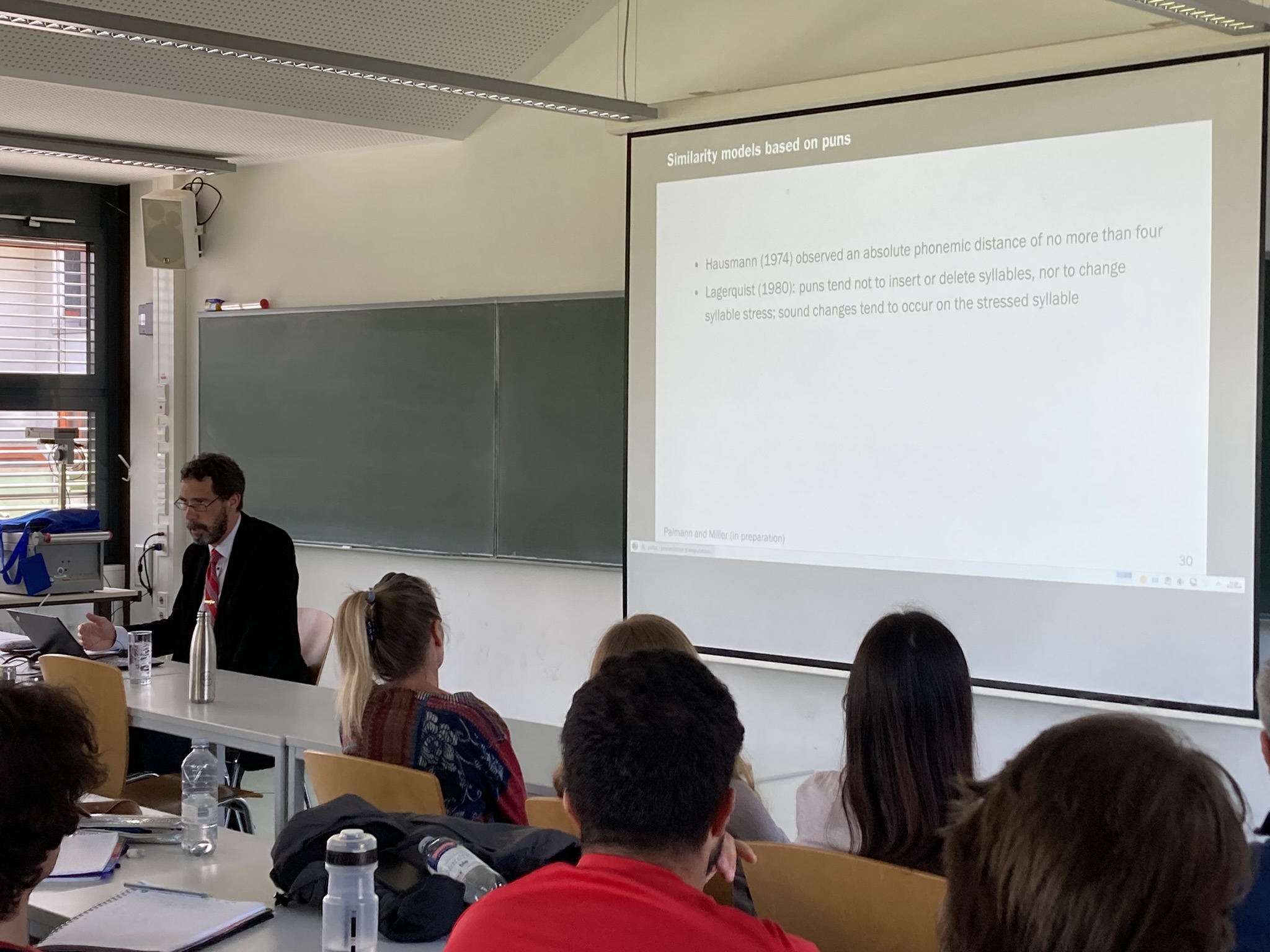 (A photograph of Tristan Miller speaking at the University of Konstanz)